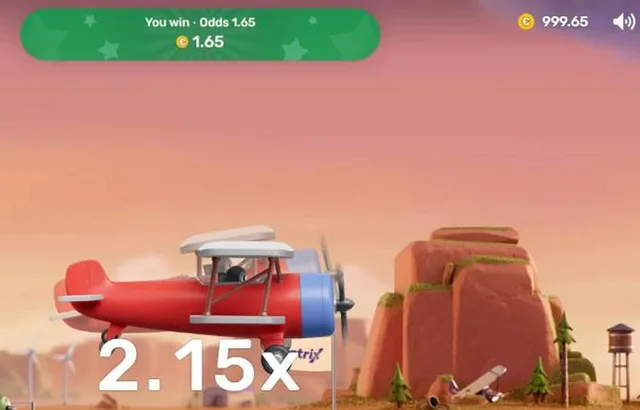 Close-up of the Aviatrix win banner reading You win, odds 1.65, above the flying biplane